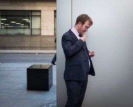 business man in central London smoking 