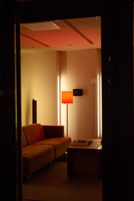 photography of shop window with sofa at night, urban landscape 