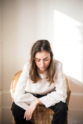 portrait photography of a young woman in interior, sunlight artist fashion designer 