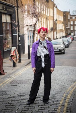portrait photography of a young man in the street in london, editorial photography 