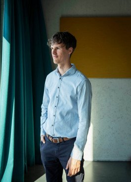 business portrait of web designer in interior, sunlight 