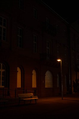 night photography nachtfotografie urban landscape building and bench with street lamp