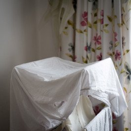 white sheets near curtain 