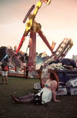 portrait of young lady in amusement park 